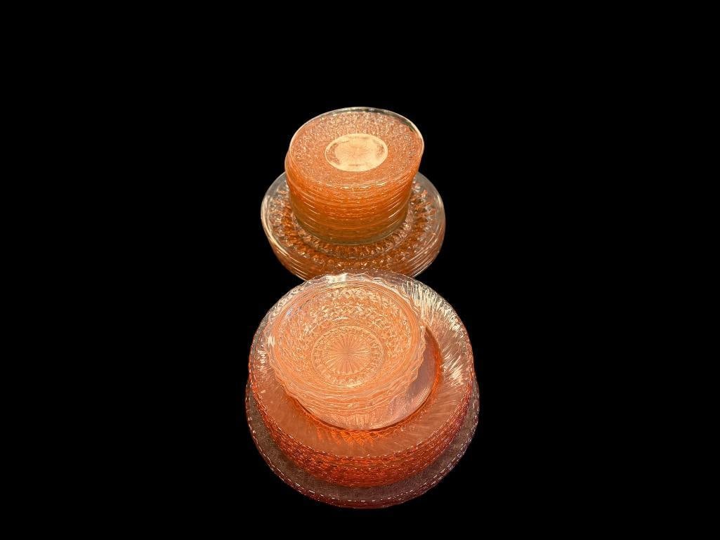 VINTAGE PINK DEPRESSION GLASS TABLEWARE INCLUDING DINNER PLATES, BREAD PLATES, AND BOWLS: 37 PIECES TOTAL, MOST APPEAR TO HAVE NO CHIPS OR CRACKS, VARIOUS PATTERNS INCLUDING HOLIDAY BUTTONS AND BOWS LARGEST PLATES ARE 9"