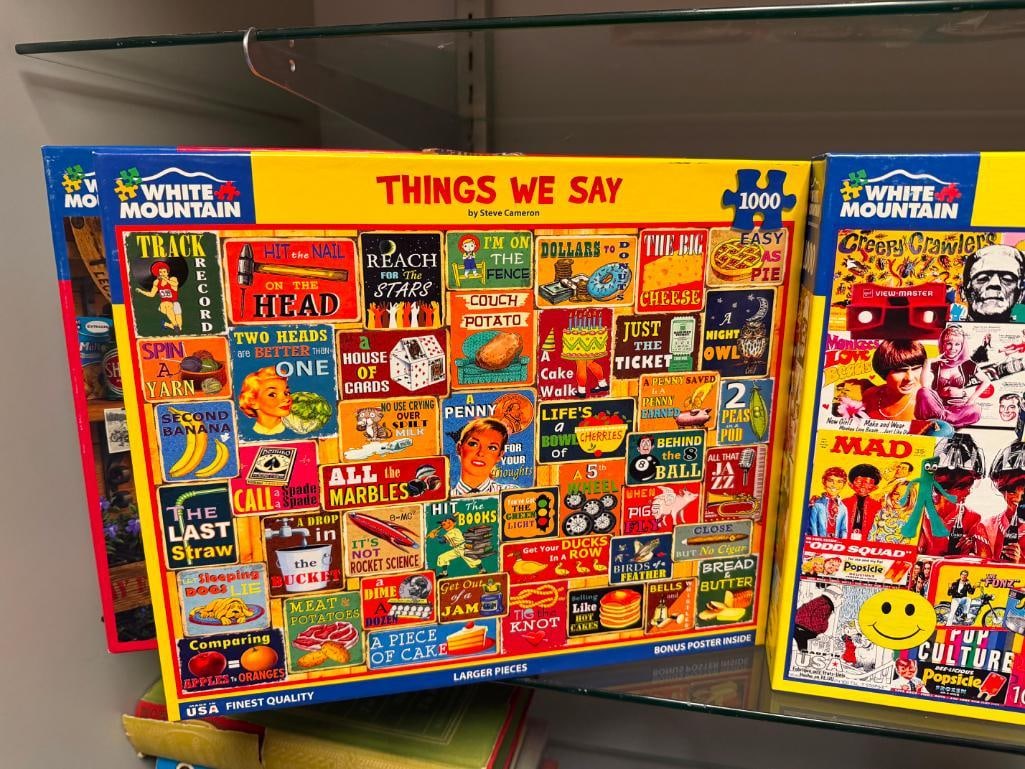 FIVE 1,000 PIECE PUZZLES INCLUDING THREE BY WHITE MOUNTAIN, STAR TREK CATS, AND CHARLES WYSOCKI - 12