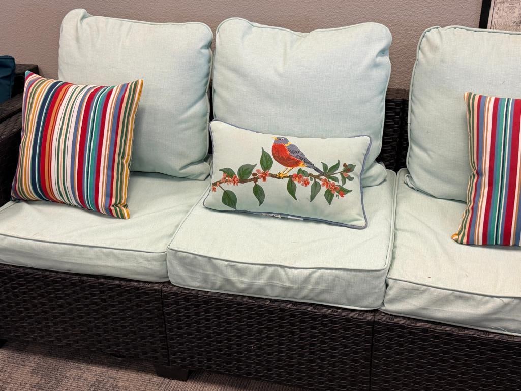 BLACK VINYL WICKER OUTDOOR / PATIO SOFA WITH LIGHT COLORED CUSHIONS AND THREE THROW PILLOWS - 2