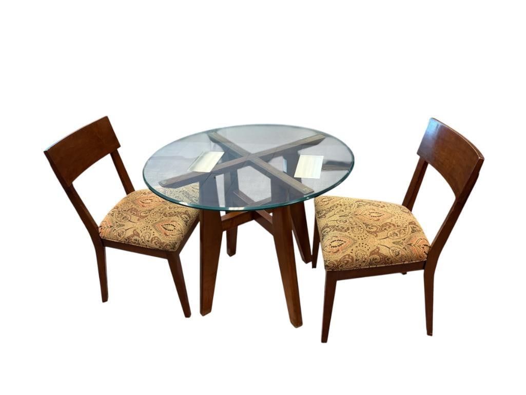 ETHAN ALLEN CONTEMPORARY ROUND BISTRO TABLE WITH GLASS TOP AND TWO CHAIRS: WOOD BASE TABLE WITH BEVELED GLASS TOP, INCLUDES TWO MATCHING CHAIRS WITH PAISLEY PATTERN UPHOLSTERED SEATS 35" ROUND TABLE