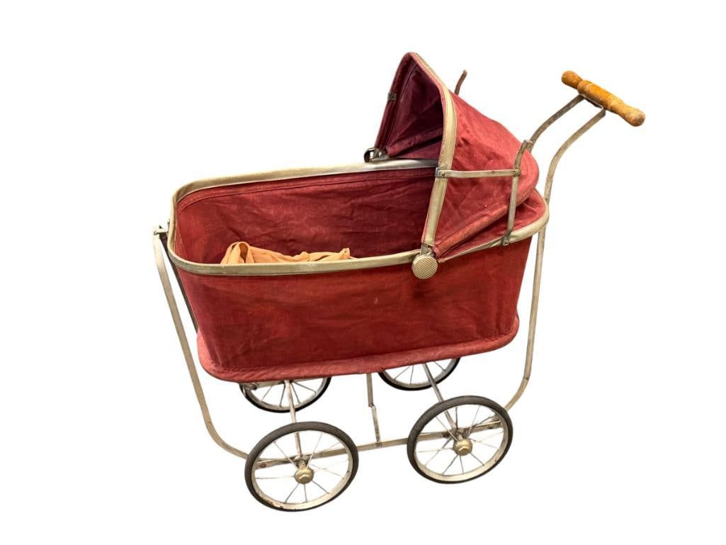 1950'S MID-CENTURY KOZEE - KAR DOLL CARRIAGE MADE BY KOZEE-KAR CO MINNEAPOLIS, MISS.: BURGANDY CLOTH CARRIAGE WITH METAL FRAME AND HARD RUBBER WRAPPED TIRES, ORIGINAL LABEL PRESENT, COMPLETE 28" L