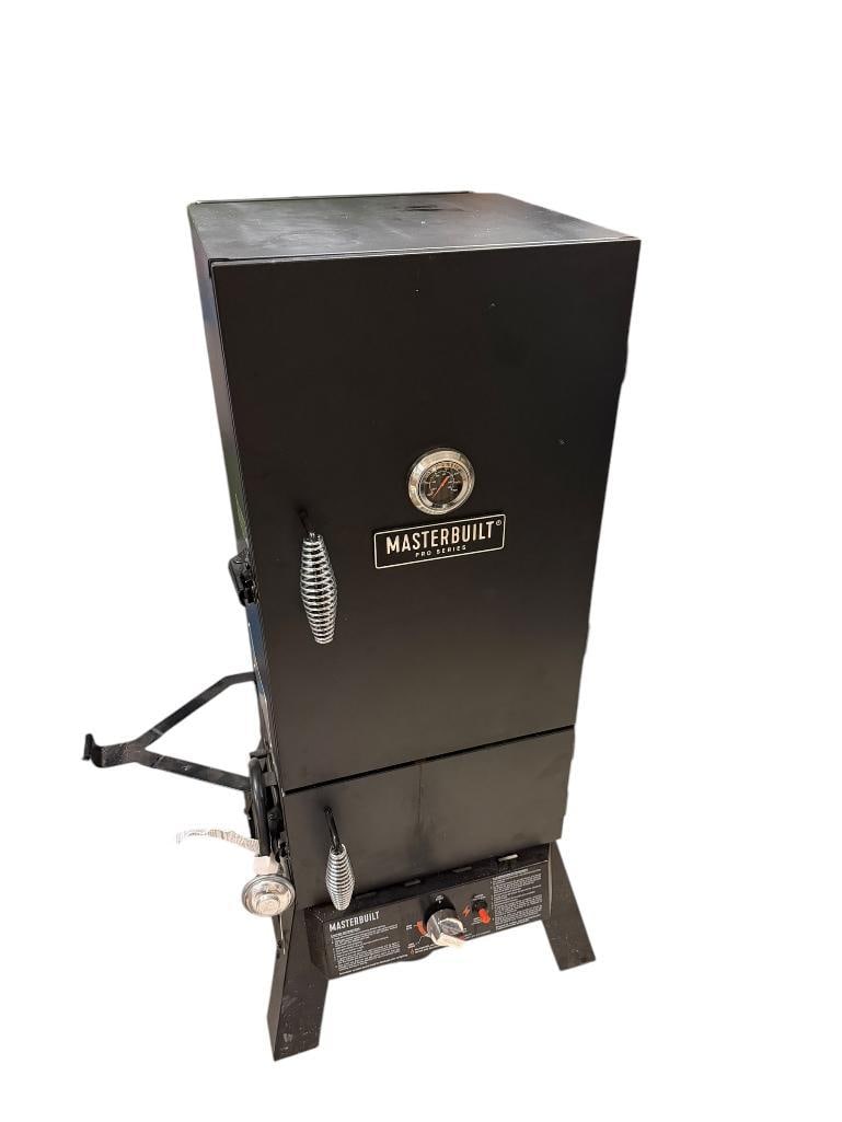 MASTERBUILT PRO SERIES PROPANE SMOKER: IN GOOD CONDITION, INCLUDES COVER, FEATURES WOOD CHIP TRAY FOR ADDING FLAVOR 16" X 15" X 44"