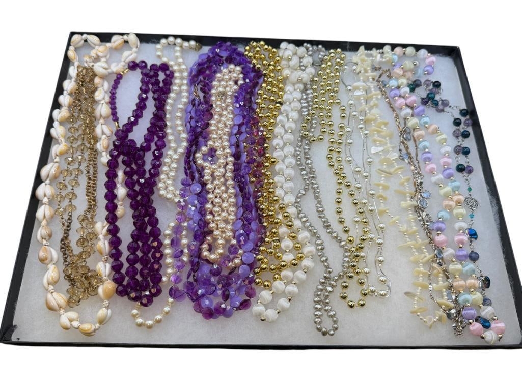 ASSORTED LADIES STAEMENT NECKLACES INCLUDING SHELL BEADS, FAUX PEARLS, PURPLE BEADS, AND MORE: VARIOUS LENGTHS INCLUDING OPERA LENGTH