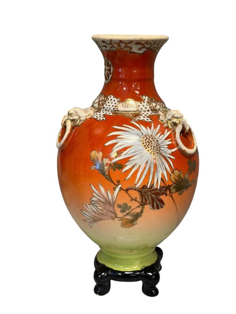 20TH CENTURY JAPANESE SATSUMA VASE WITH MORIAGE RAISED DECORATION FLORAL / CHRYSANTHEMUM MOTIF: FOUR-FOOTED VASE WITH BULBOUS BODY, FEATURES ELEPHANT STYLIZED RING HANDLES, MORIAGE DECORATION, WITH GILT ACCENTS, NO DAMAGE OR REPAIRS 12 1/2" H