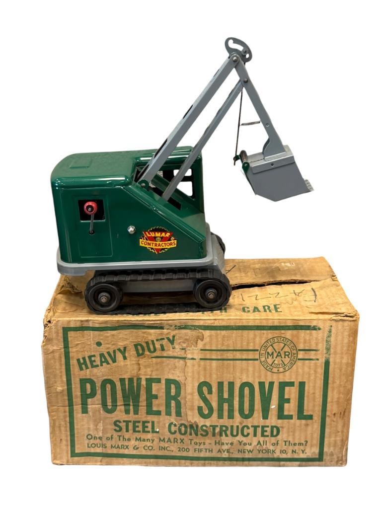 1950'S MARX LUMAR CONTRACTORS PRESSED STEEL TOY STEAM SHOVEL CONSTRUCTION TOY: GREEN ADN GREY WITH RUBBER TRACKS, IN NEAR MINT CONDITION, RUBBER TRACKS ARE A BIT DRY AND DO HAVE A FEW CRACKS, ONE TRACK HAS BEEN PREVIOUSLY REPAIRED, INCLUDES ORIGINAL BOX 12" H