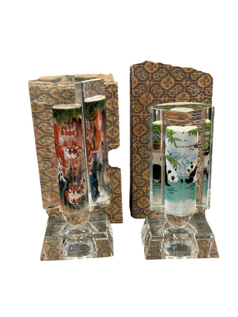 20TH CENTURY CHINESE REVERSE PAINTED ILLUMINATING PRISMS WITH SCENES OF TIGERS AND PANDAS: CUT GLASS PRISMS WITH REVERSE PAINTED SCENES OF TIGERS AND PLAYFUL PANDAS, EACH PRISM IS MOUNTED ON RECTANGULAR BASE WITH FACETED CENTER, EACH PIECE INCLUDES LED BATTERY OPERATED LIGHT AND ORIGINAL