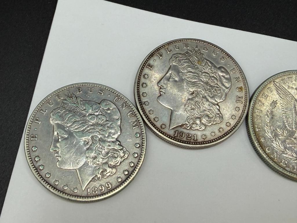 FIVE U.S. MORGAN SILVER DOLLARS FEATURING VARIOUS DATES AND MINT MARKS - 7