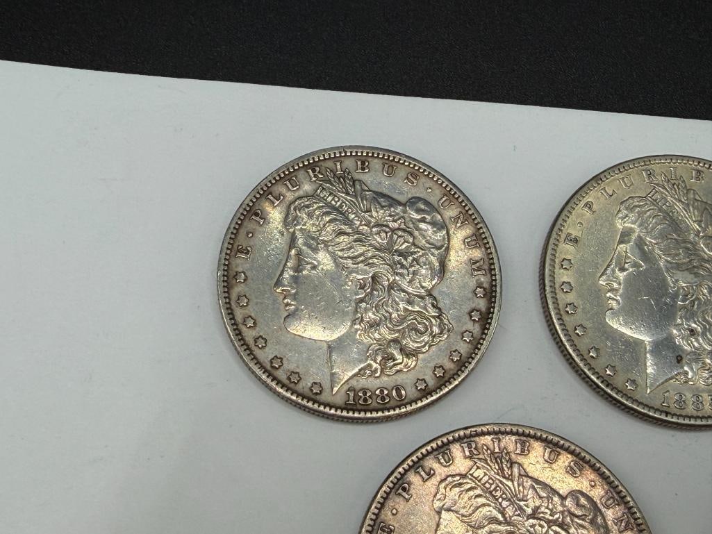 FIVE U.S. MORGAN SILVER DOLLARS FEATURING VARIOUS DATES AND MINT MARKS - 2