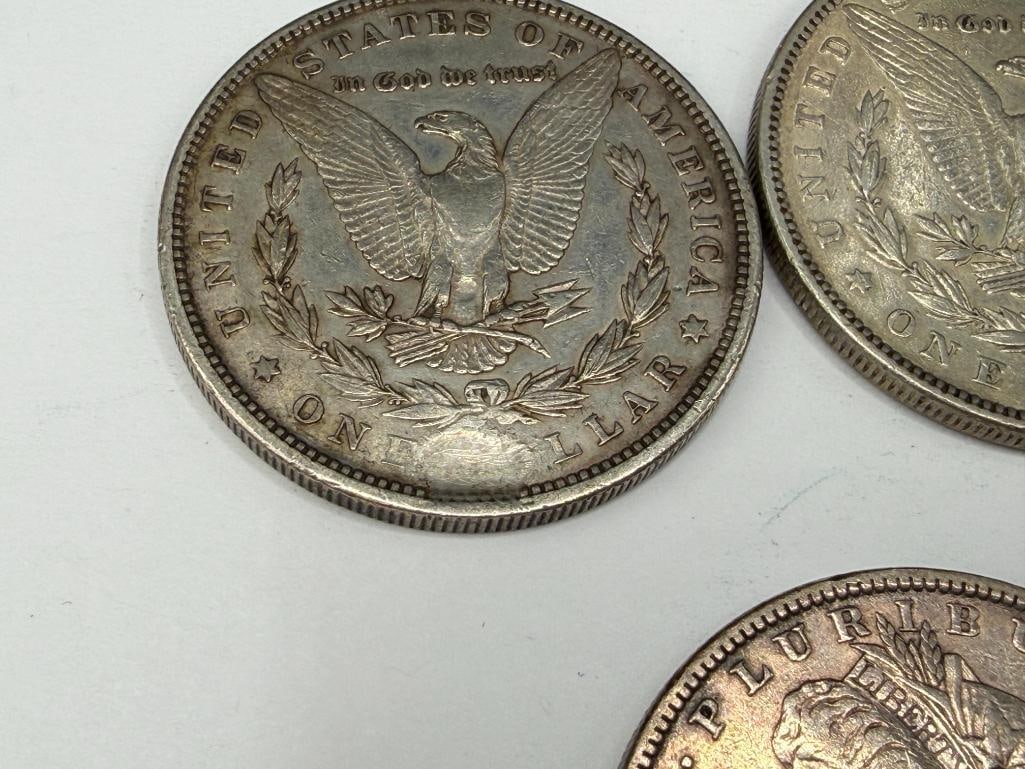 FIVE U.S. MORGAN SILVER DOLLARS FEATURING VARIOUS DATES AND MINT MARKS - 5