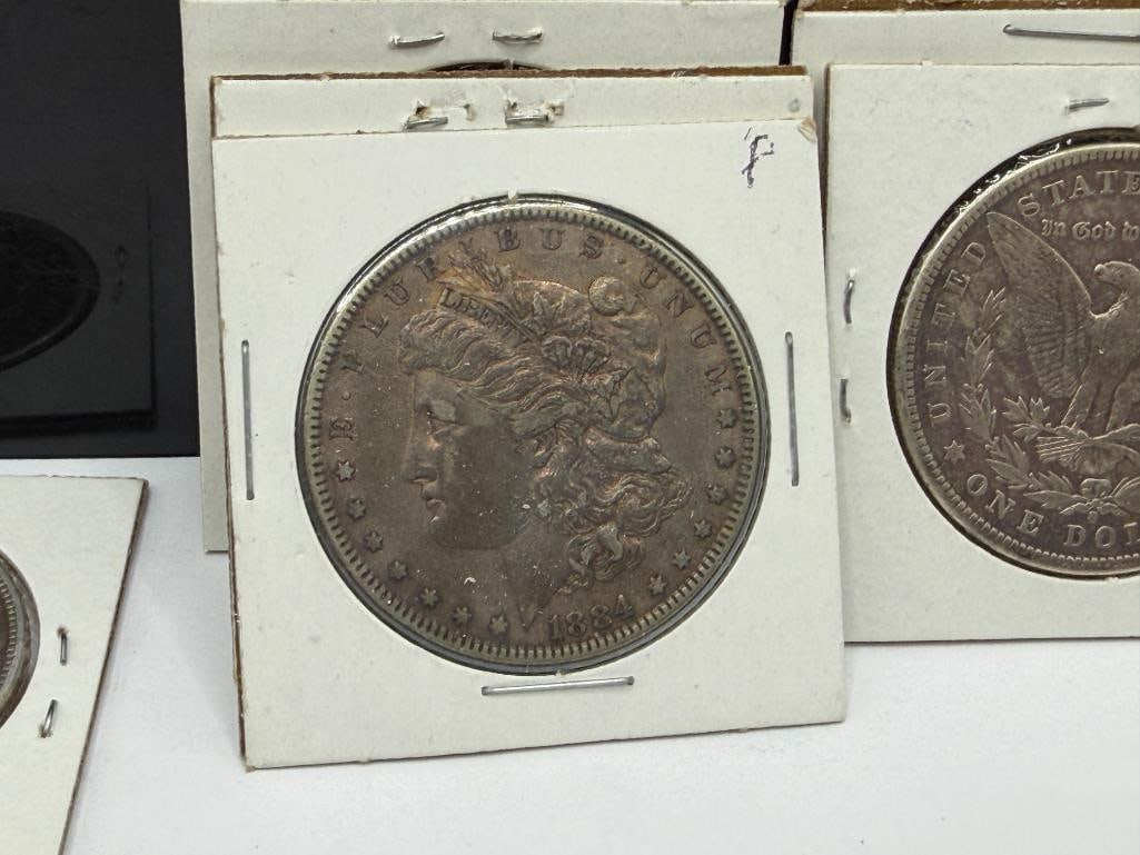 SEVEN U.S. MORGAN SILVER DOLLARS FEATURING VARIOUS DATES AND MINT MARKS - 14