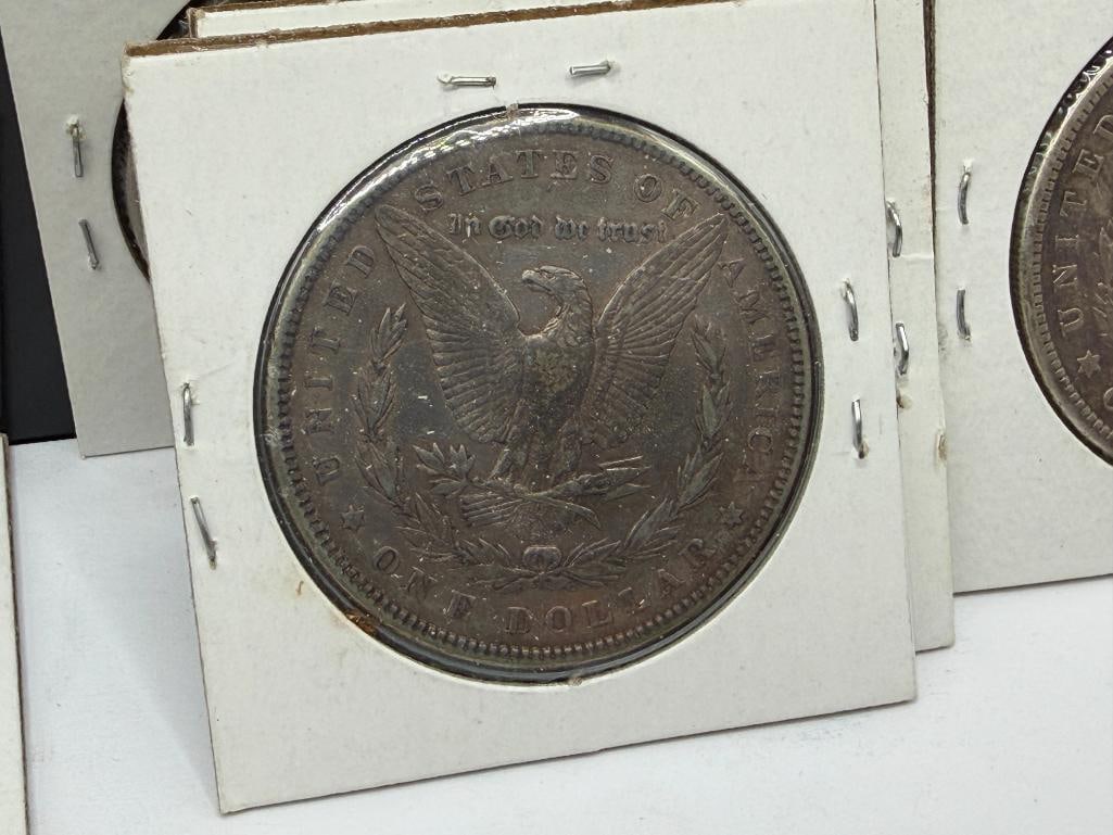 SEVEN U.S. MORGAN SILVER DOLLARS FEATURING VARIOUS DATES AND MINT MARKS - 16