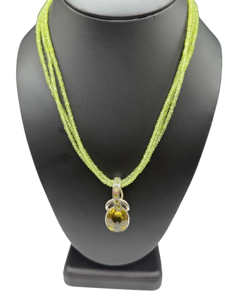 STERLING SILVER FACETED ROUND CUT PERIDOT PENDANT SLIDE ON MULTI-STRAND PERIDOT BEAD NECKLACE: CLASP ON NECKLACE IS SILVER PLATED 17" NECKLACE, 1 1/2" PENDANT, LARGEST CITRINE ON PENDANT IS 20MM X 15MM