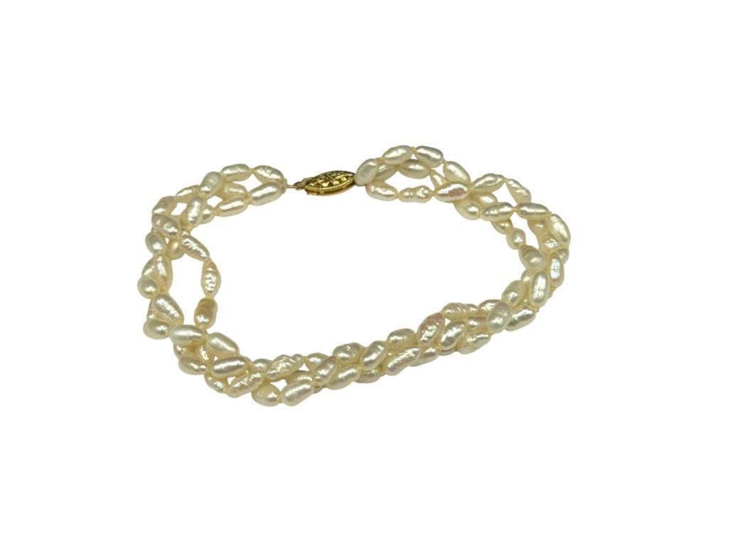 TRIPLE STRAND FRESHWATER PEARL BRACELET WITH 14K YELLOW GOLD CLASP: STRANDS NEED REPAIR AT CLASP 8"