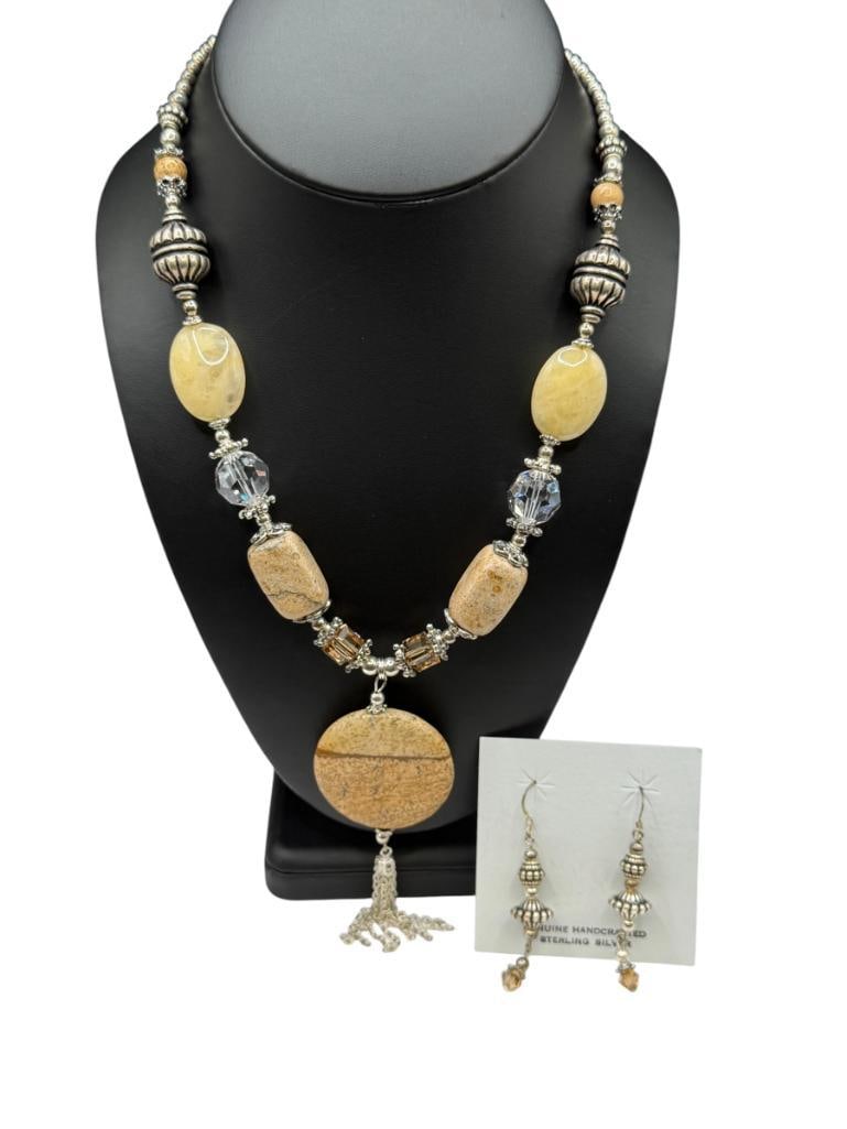 SILVER PLATED NECKLACE AND MATCHING EARRINGS FEATURING BROWN STONES AND QUARTZ BEADS: ACCENTED BY VARIOUS BEADS INCLUDING SILVER PLATED BEADS, FACETED GLASS BEADS, AND MORE 18" NECKLACE WITH 4" EXTENDER, 4" DROP PENDANT, 2 1/4" EARRINGS