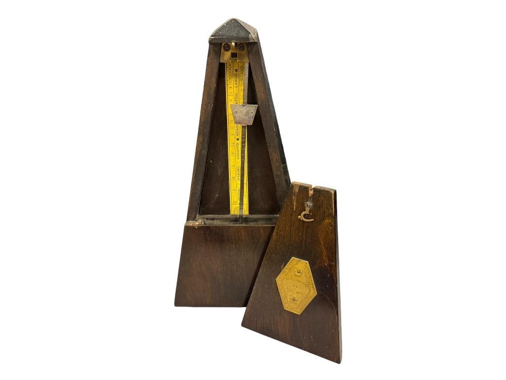 METRONOME DE MAELZEL CLASSIC DESIGN WITH AMERICAN MOVEMENT: DARK FINISHED CASE, ORIGINAL LABEL ON THE BACK OF THE DOOR, MOVEMENT IS MARKED MADE IN US.A. AMERICA 9" H
