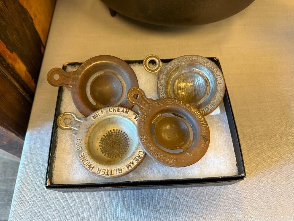 ANTIQUE ADVERTISEMENT TIN EGG YOLK AND CRREAM SEPARATORS WITH EMBOSSED LETTERING: ADVERTISEMENT EGG AND CREAM SEPARATORS WITH EMBOSSED LETTERING AND THUMB TAB HANDLES FROM BLOWEY-HENRY FURNITURE, CARPETS, DEPENDABLE DELCO-LIGHT FARM ELECTRICITY, MILK CREAM VIMPA ICE CREAM BUTTER WI