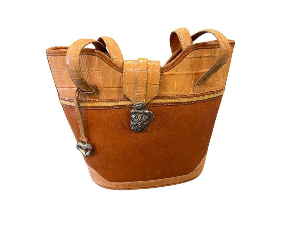 BRIGHTON TWO-TONE BROWN LEATHER SATCHEL WITH DECORATIVE BUCKLE AND HEART CHARM: ALLIGATOR GRAIN TRIM AND STRAPS, BAG DOES SHOW WEAR, NO TEARS OR HEAVY FRAYING 11 1/2" X 4 1/2" X 9"