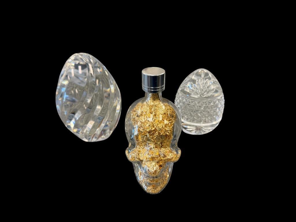 LENOX AND FRENCH MADE CRYSTAL EGG PAPERWEIGHTS PLUS GOLD FLAKE FILLED SKULL PAPERWEIGHT: SPIRAL DESIGN LENOX PAPERWEIGHT, WATERMARK ON THE BOTTOM, AND OTHER IS MARKED FRANCE 3 1/4" AND 4 1/4" H