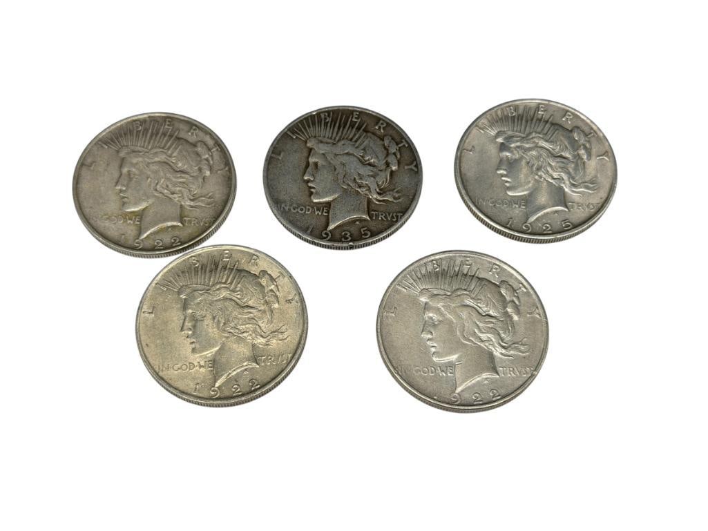 FIVE U.S. PEACE SILVER DOLLARS: INCLUDING TWO 1922, 1922-D, 1925, AND 1935-S, 90% SILVER
