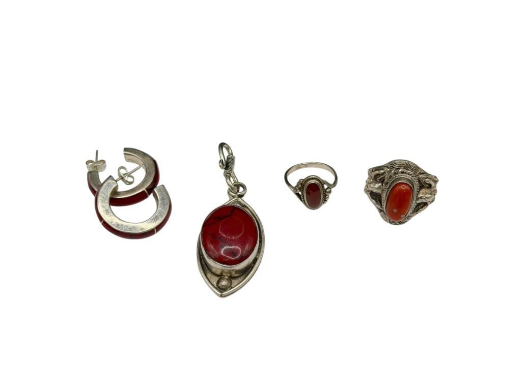 STERLING SILVER RED JASPER AND RED CORAL JEWELRY INCLUDING SOME MADE IN MEXICO TAXCO DESIGNS: PAIR OF RED JASPER HOOP EARRINGS, RED JASPER MARQUISE SHAPED PENDANT, TWO RED CORAL RINGS, PENDANT HAS TAXCO MARKINGS 2 1/2" PENDANT, 33.09 GRAMS