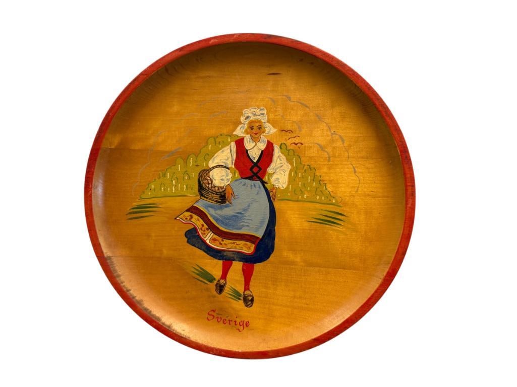 VINTAGE HAND TURNED WOOD SWEDISH SOUVENIR PLATE WITH HAND PAINTING OF A WOMAN INSCRIBED "SVERIGE": MADE IN SWEDEN 11" ROUND