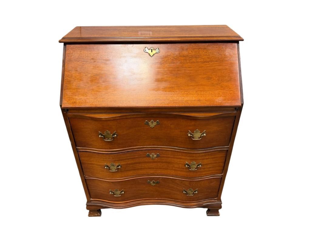 SERPENTINE FRONT DROP FRONT SECRETARY'S DESK: FEATURES THREE DRAWERS WITH DROP FRONT, IN GOOD CONDITION WITH NO HEAVY USE 29" X 16" X 37" 