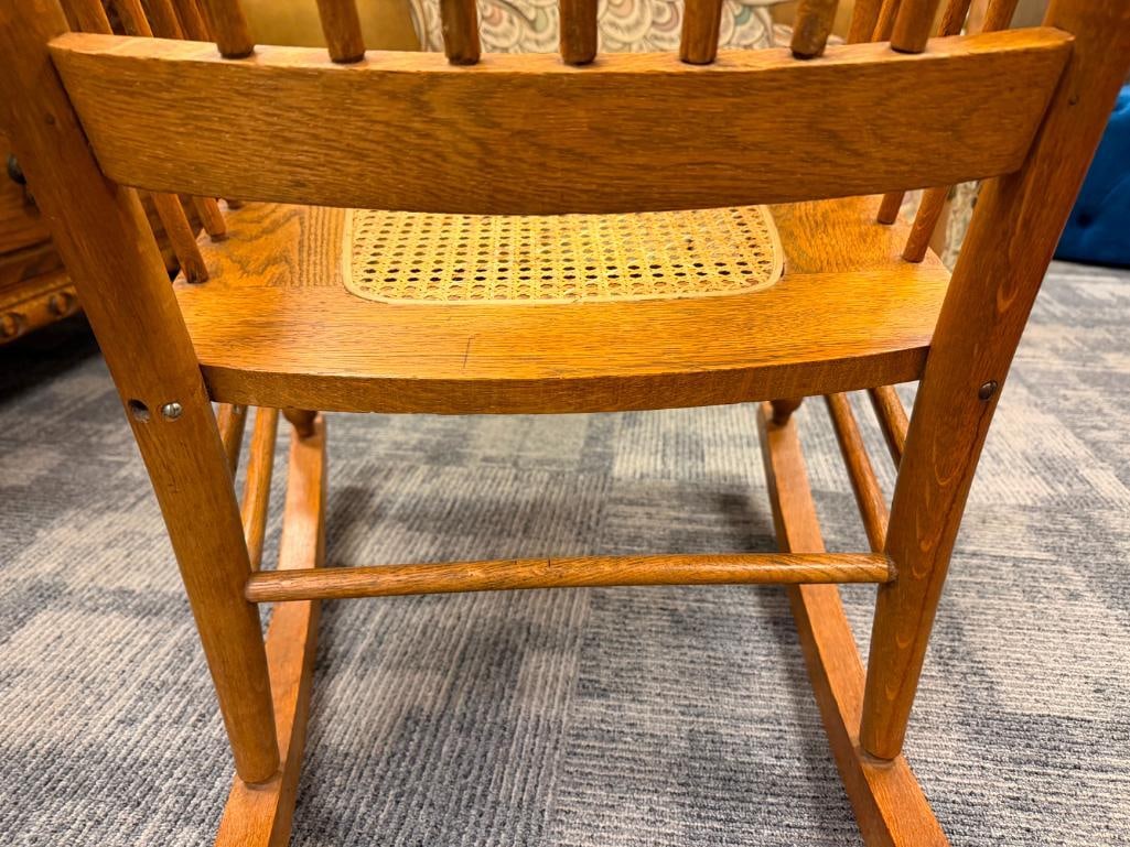 ANTIQUE OAK SPINDLE ROCKING CHAIR WITH PRESSED BACK AND CANE SEAT - 9