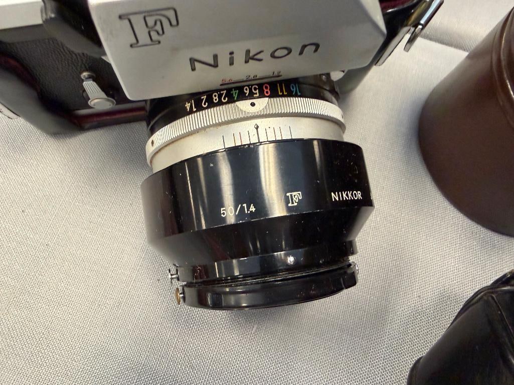 NIKON F 35MM SLR PROFESSIONAL FILM CAMERA INTRODUCED IN 1959 PLUS NIKKOR-H 28MM LENS NO. 631967 - 4