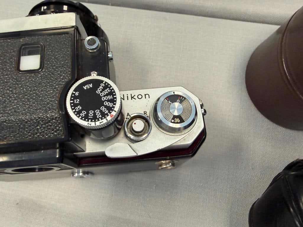 NIKON F 35MM SLR PROFESSIONAL FILM CAMERA INTRODUCED IN 1959 PLUS NIKKOR-H 28MM LENS NO. 631967 - 6