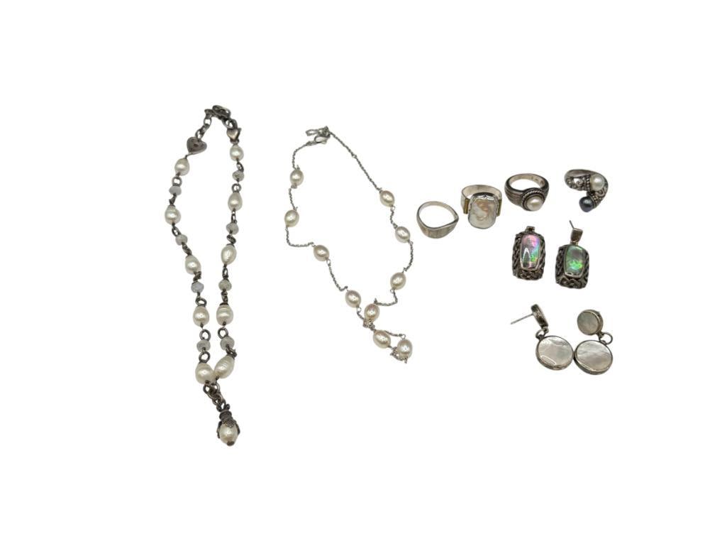 STERLING SILVER PEARL AND MOTHER OF PEARL ACCENTED JEWELRY: INCLUDES RINGS, EARRINGS, AND NECKLACES 77.57 GRAMS