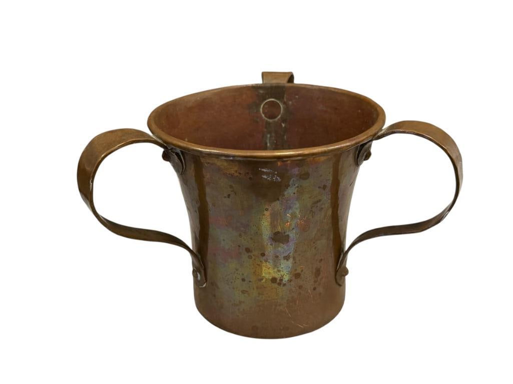 ANTIQUE THREE-HANDLED JUCAICA / PASS CUP HAND HAMMERED COPPER DOVETAIL CONSTRUCTION: FEATURES ROLLED RIM, SOLID CONSTRUCTION, SMALL DENT ON THE BOTTOM EDGE 4" H