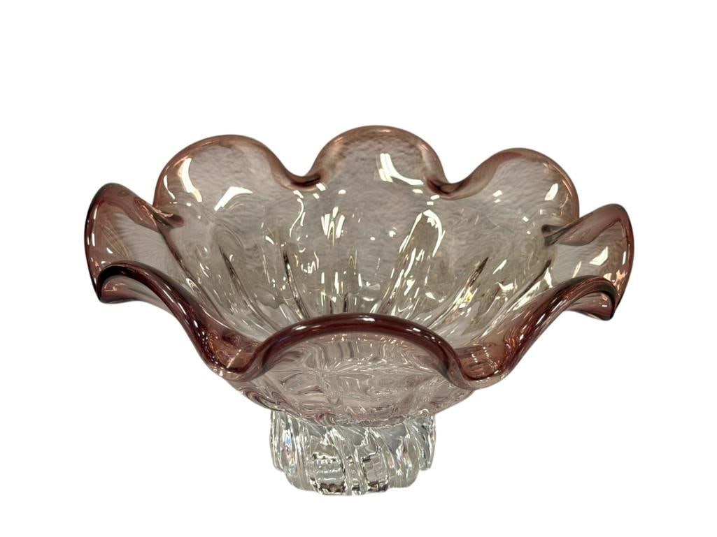 LARGE HAND BLOWN ART GLASS FOOTED BOWL: CLEAR BASE WITH PURPLE PINCHED RIM, LIGHT SCRATCHES ON THE BOTTOM OF THE BASE 9 1/2" ROUND