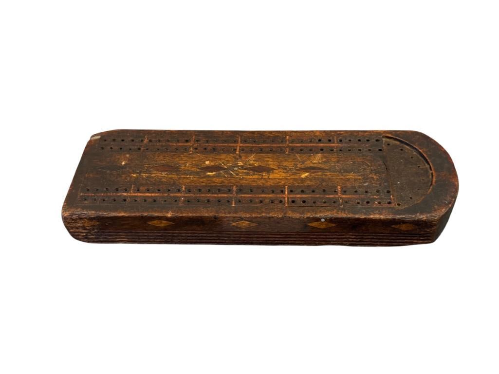 19TH CENTURY HAND CRAFTED OAK CRIBBAGE BOARD WITH DIAMOND DESIGN INLAY: DIAMOND INLAY ALONG THE TOP OF THE GAME BOARD AND ALONG THE SIDES, DOES SHOW HEAVY WEAR FROM AGE / USE 11 3/8" X 3 3/4"