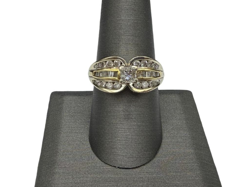 14K YELLOW GOLD DESIGNER HALLMARKED DIAMOND ENGAGEMENT RING: FEATURING A PRINCESS CUT DIAMOND IN CENTER ACCENTED BY BAGUETTE AND ROUND BRILLIANT CUT DIAMONDS RANGING IN SIZE, DESIGNER HALLMARKED "LIM" SIZE 8 3/4, 7/16" FRONT, 1.23CTTW DIAMONDS, CENTER DIAMOND