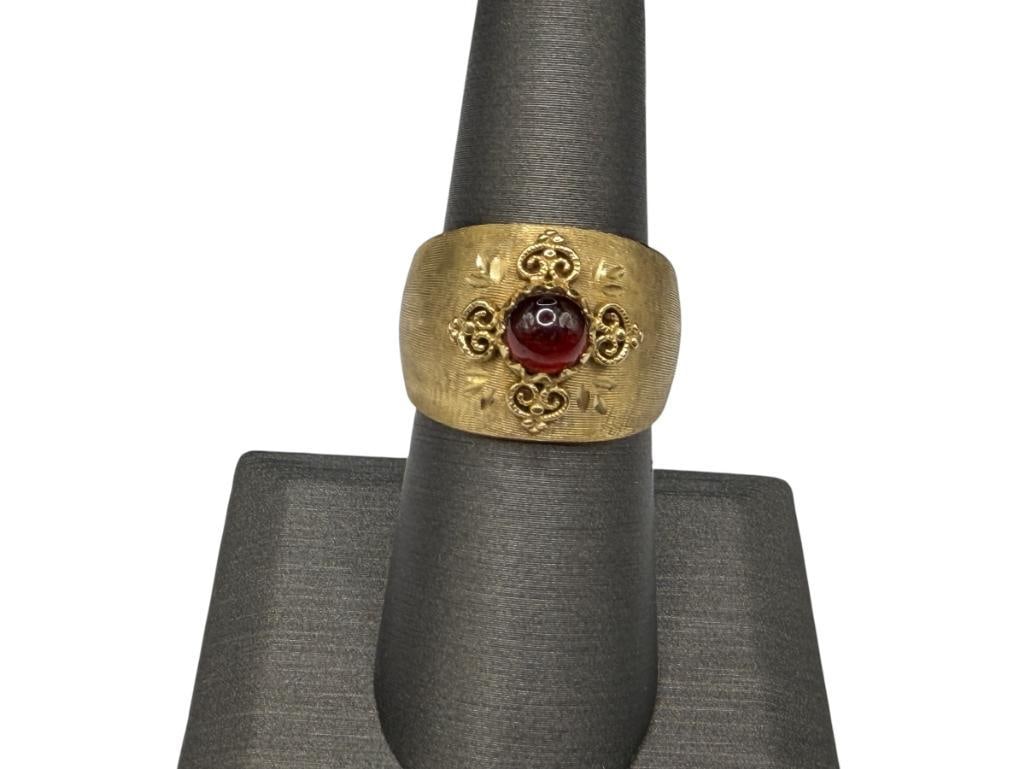 14K YELLOW GOLD ITALIAN MILOR ROUND CABOCHON GARNET RING: FEATURING ITALIAN SCROLL DESIGN AROUND CABOCHON, MARKED "MADE IN ITALY MILOR" SIZE 7, 5/8" FRONT, 4.03 GRAMS, 6MM GARNET