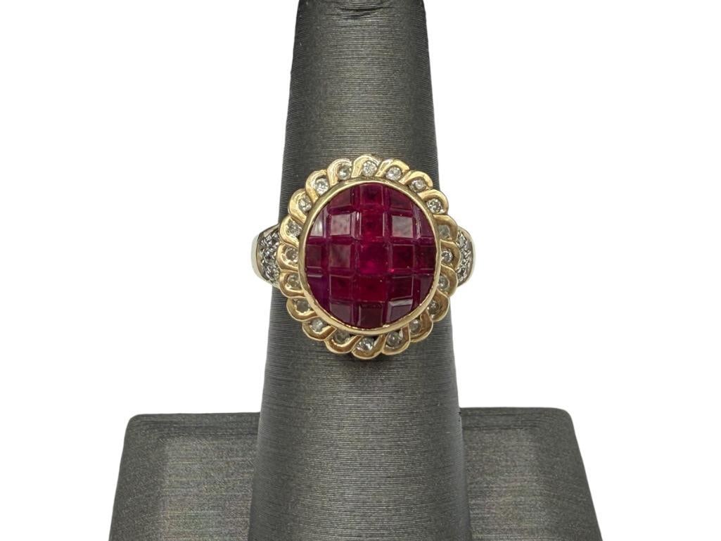 14K YELLOW GOLD PRINCESS CUT RUBY AND DIAMOND FASHION RING: FEATURING RUBIES SET IN CHECKERBOARD DESIGN SURROUNDED BY ROUND BRILLIANT CUT DIAMONDS, 21 RUBIES FEATURING PRINCESS AND VARIOUS CUTS SIZE 5 3/4, 5/8" FRONT, 5.58 GRAMS, UP TO 2.5MM RUBIES, 1MM