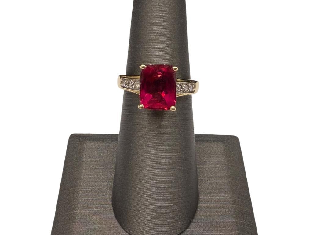14K YELLOW GOLD RECTANGLE CUT RUBELLITE AND ROUND BRILLIANT CUT DIAMOND FASHION RING: FEATURING FANCY PIERCED SCROLL DESIGN ON SHOULDERS OF SHANK, DESIGNER HALLMARKED SIZE 6, 10MM X 8MM RUBELLITE, 1MM DIAMONDS, 4.00 GRAMS