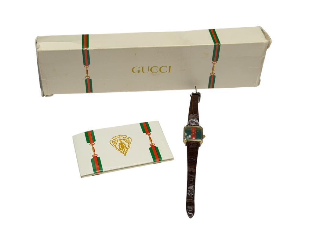 VINTAGE GUCCI DESIGNER MARKED QUARTZ LADIES WRISTWATCH: INCLUDES ORIGINAL BOX AND BOOKLET, ONE JEWEL, NEEDS NEW BATTERY 21MM CASE