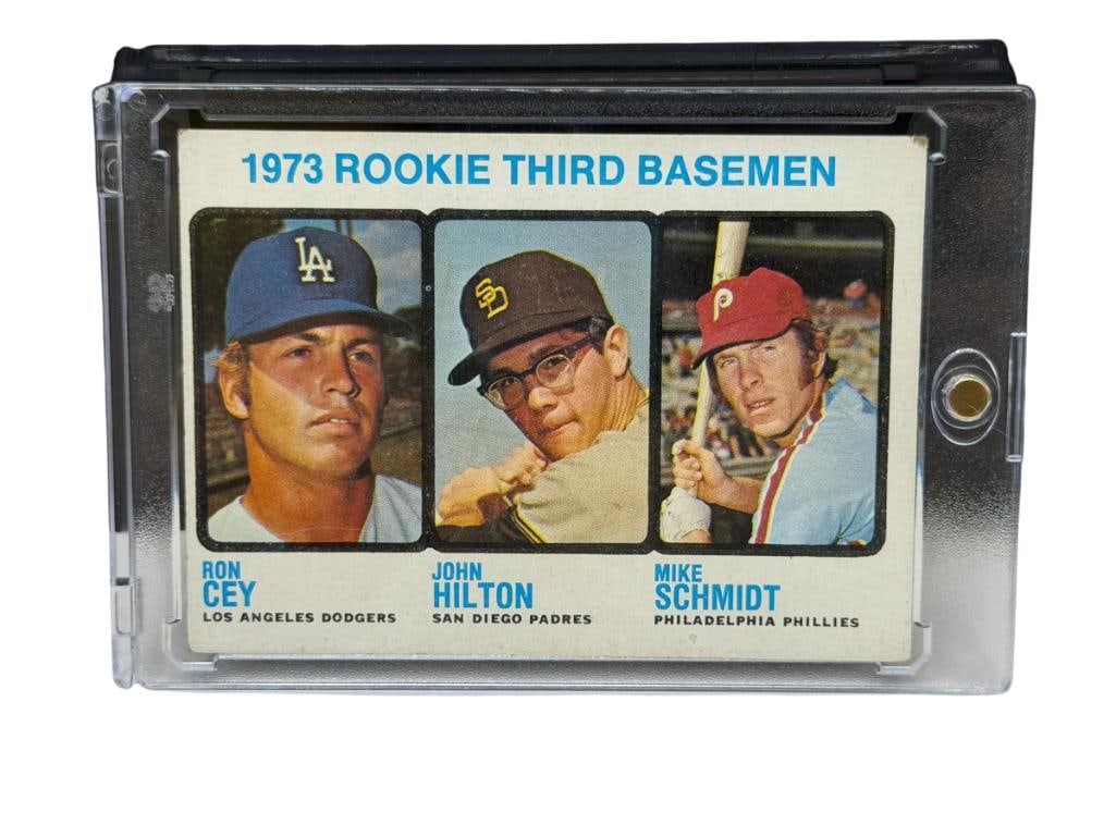1973 TOPPS #615 1973 ROOKIE THIRD BASEMAN BASEBALL CARD FEATURING MIKE SCHMIDT: TRIPLE ROOKIE CARD FEATURING HALL OF FAMER MIKE SCHMIDT, RARE CARD, SEE PHOTOS FOR CONDITION, FROM THE ESTATE OF A LOCAL RENO, NV DOCTOR AT RENOWN WHO RAN BIG LEAGUE SPORTS MEDICINE BASEBALL CAMP