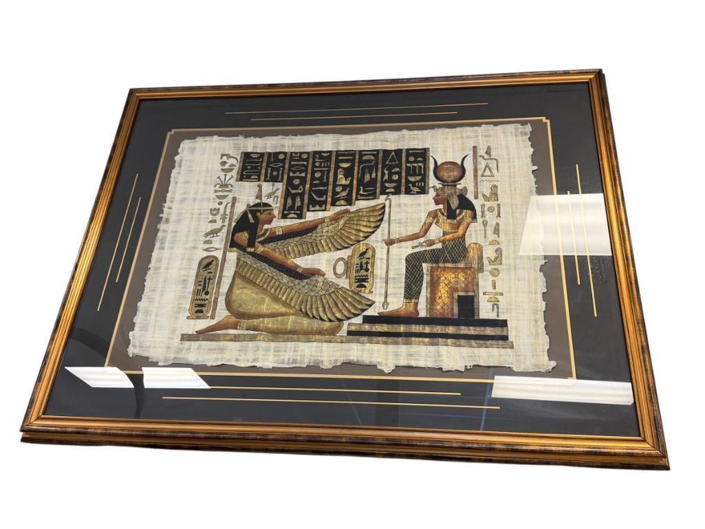 LARGE EGYPTIAN ORIGINAL PAINTING ON PAPYRUS PAPER OF EGYPTIAN GODDESSES: ART DEPICTS KNEELING GODDESS ISIS WITH HER WINGS SPREAD, FEATURES HIEROGLYPHICS IN BLACK AND GOLD, SIGNED LOWER LEFT, FRAMED 51 1/2" X 40" FRAME