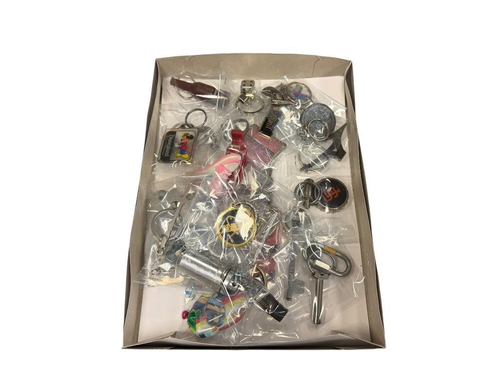 ASSORTED KEY CHAINS AND BOTTLE OPENERS DISNEYLAND, SF GIANTS, WINCHETER, NASA, DICE, ETC.: 26 TOTAL 
