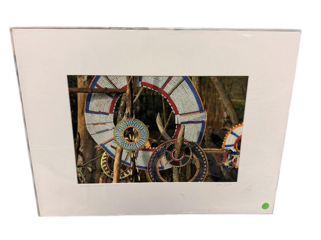 JOANN LIPPERT " MAASAI ORNAMENTATION-TANZANIA " SIGNED PHOTOGRAPH PRINT: WILD ENCOUNTERS PHOTOGRAPHY, MATTED AND WRAPPED IN PLASTIC, SIGNED BY ARTIST IN LOWER RIGHT ON MATTING, DEPICTS EXCEPTIONAL BEAD WORK ONAMENTATION DESIGNS 24" X 18" MATTING