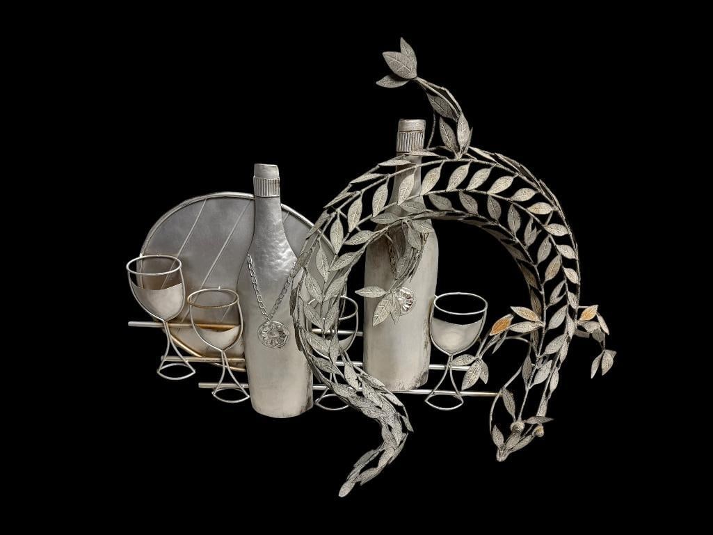 TWO PIECES OF METAL WALL ART INCLUDING WINE MOTIF AND OTHER FEATURES FLORAL PATTERN WREATH (1 of 12)