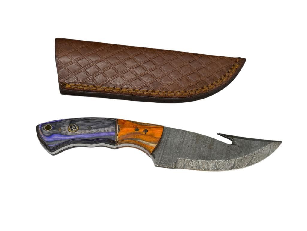 DAMASCUS STEEL FIXED BLADE KNIFE WITH GUT HOOK: FEATURES FULL TANG BLADE, DYED PURPLE AND ORANGE WOOD HANDLE, INCLUDES A LEATHER SHEATH 4 1/4" BLADE, 8" TOTAL LENGTH