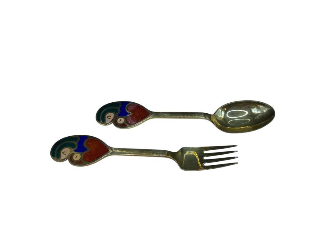 VINTAGE JUL 1968 A. MICHELSEN DANMARK STERLING SILVER A MOTHER'S HEART DESIGN FORK AND SPOON: BRASS PLATED WITH VIBRANT ENAMELED DESIGN, MARKED ON EACH SPOON 6 1/2", 89,62 GRAMS TOTAL