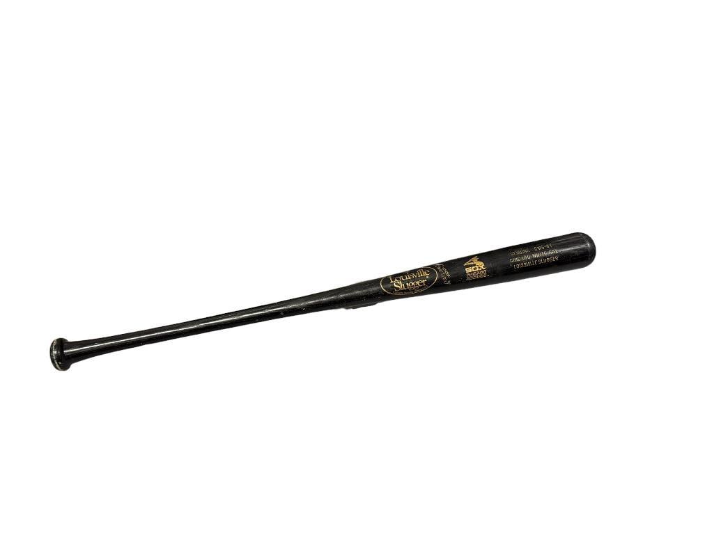 1980'S LOUISVILLE SLUGGER 125 CWS-87 WHITE SOX WOODEN BASEBALL BAT IN BLACK WITH GOLD LETTERING: SHOWS SOME WEAR 34 1/2" L