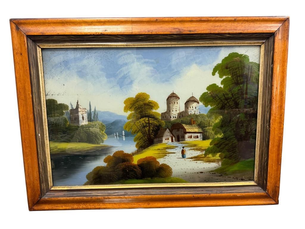 ANTIQUE REVERSE PAINTED GLASS PAINTING OF A EUROPEAN VILLAGE SCENE WITH CASTLES AND RIVER: 29" X 21" FRAME