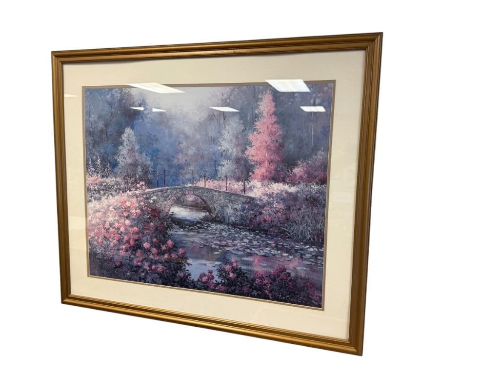 TAN CHUN CHIU CHINESE BORN ARTIST LARGE PRINT LANDSCAPE: ART DEPICTS COBBLESTONE BRIDGE IN AUTUMN WITH LILY PADS IN THE RIVER, PLATE SIGNED LOWER RIGHT, FRAMED 38" X 32" FRAME