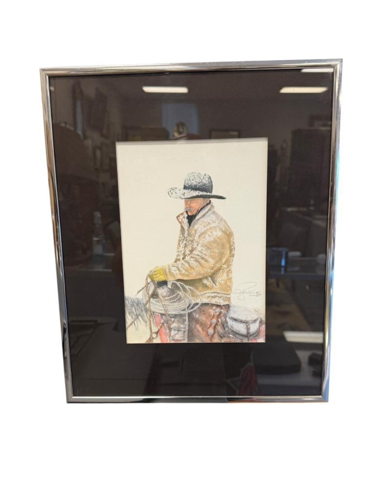 WESTERN PRINT OF A COWBOY ON HORSEBACK DURING SNOWFALL: PLATE SIGNED LOWER RIGHT, 13 1/2" X 16 1/2" FRAME