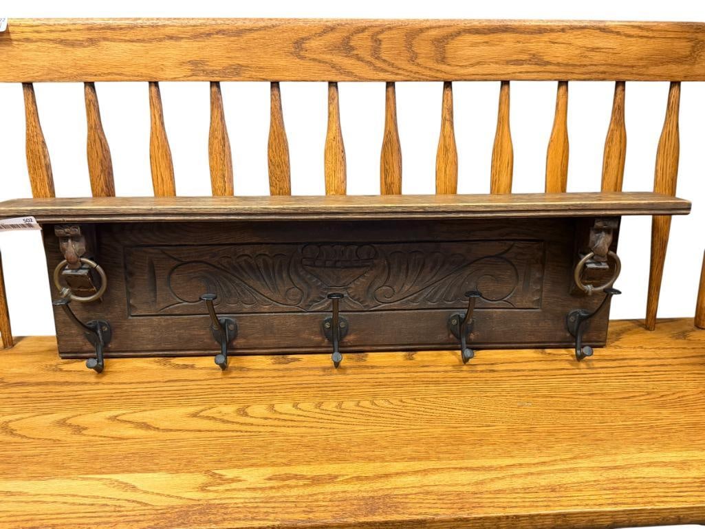 20TH CENTURY CARVED OAK HAT / COAT RACK WITH BRASS RINGS AND CAST IRON HOOKS: 33" X 8"